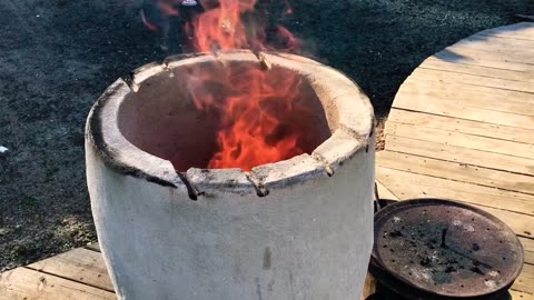 Pizza in a Tandoor First Attempt at cooking a Pizza on our DIY Wood Fired Tandoor Oven.