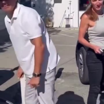 People in a Strange Foreign Land Trying to Fill Car Tires With Propane