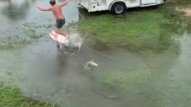 Dude's at home on his surfboard