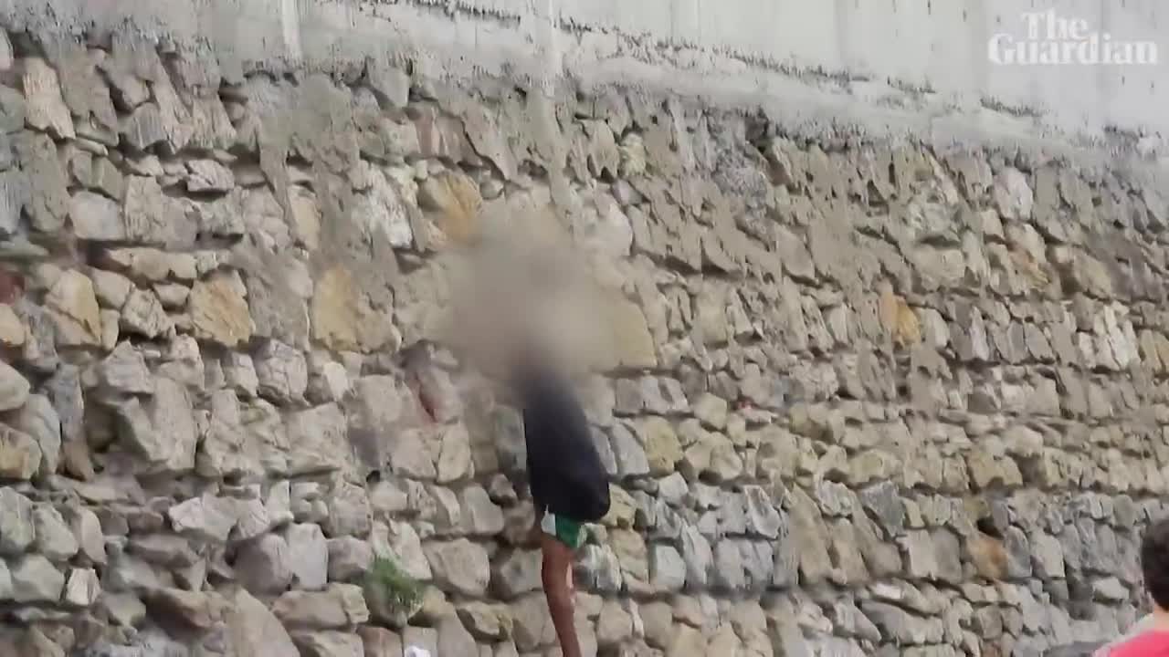 Migrant boy swims to beach in Spain's Ceuta with plastic bottles to stay afloat