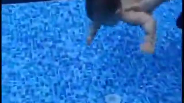 Small baby swimming under the water