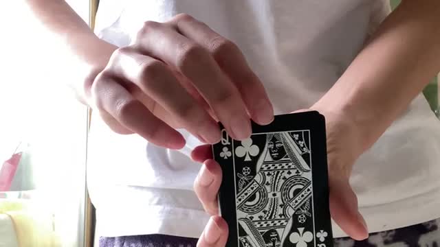 Video of a young boy practicing card magic