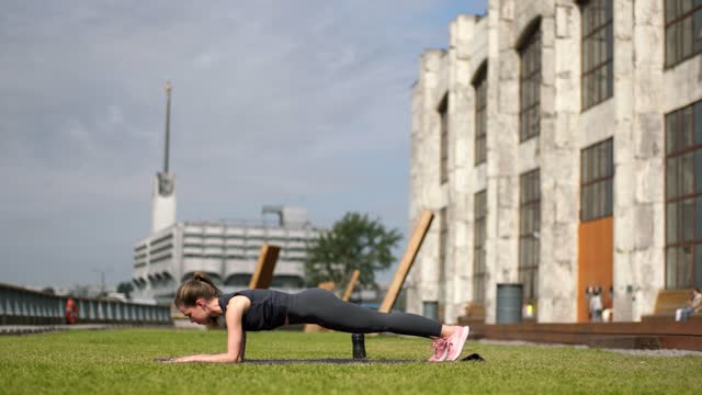 Woman Doing Push-Up And Stretching Exercise