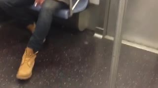 Man smoking and spitting on floor green jacket