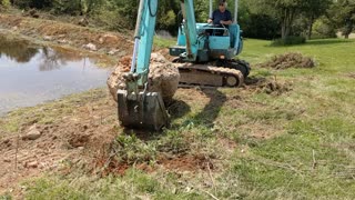 Rolling Boulder Into pond