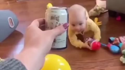 Small baby cheersing with his mother and drinking