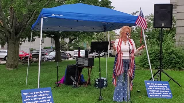 Gail Golec speaks at the rally for statewide audit of all ballots in New Hampshire