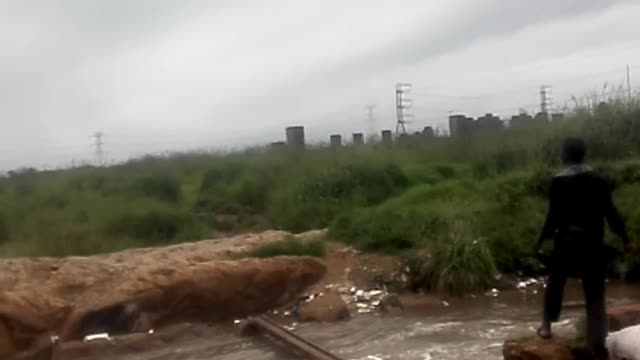 Crossing Over a Sewerage River| Poor South Africans