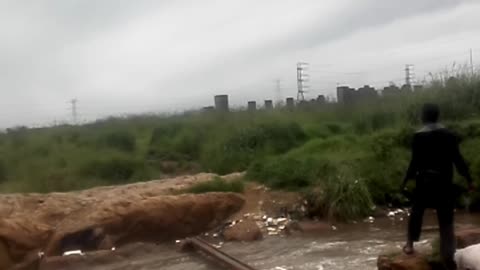 Crossing Over a Sewerage River| Poor South Africans