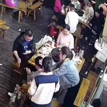 Woman using a lighter to ignite her friend's hydrogen balloon