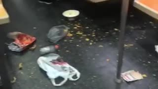 Subway train floor dirty with trash and food