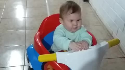 Baby on the toy bike