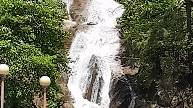 Water falls from the waterfall.