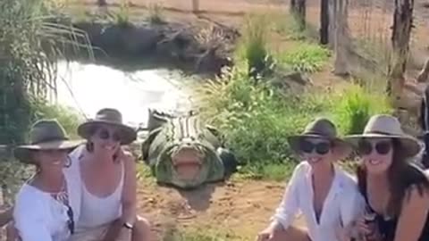 Australian women take a photo with a crocodile and get scared