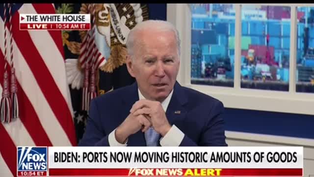 Shipping containers in the background. White hats in control.