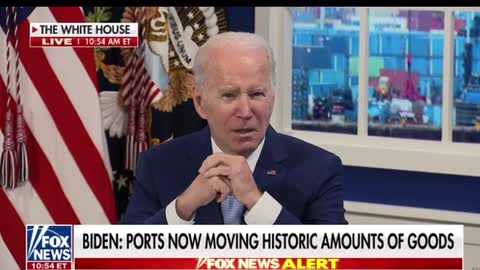 Shipping containers in the background. White hats in control.