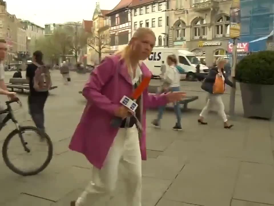 Pedestrian Takes out Cyclist with his Umbrella during Live TV Broadcast