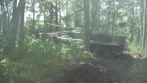 Russian T-72 and BMP-3 firing at the horizon