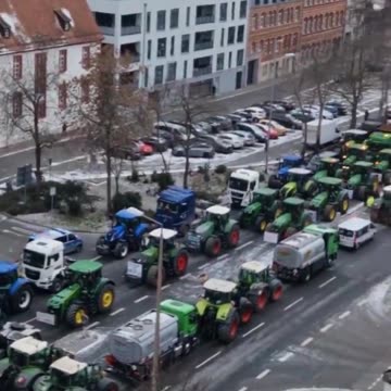 German farmers block roads with tractors in protest against plan to scrap diesel tax breaks.