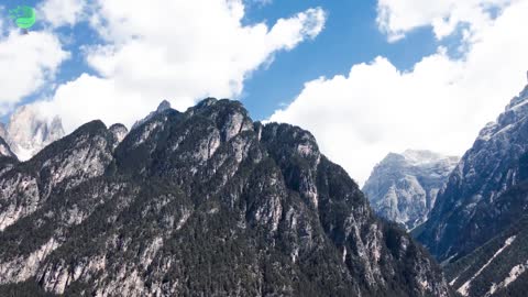 Time Lapse of mountain landscape with moving clouds