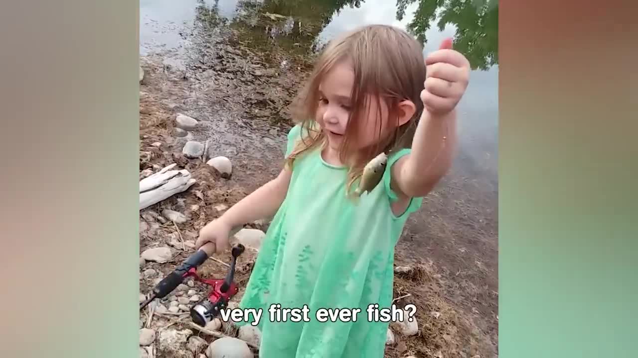 Baby playing with fish