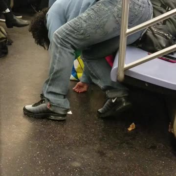 Grey pants woman passed out bent over seat subway