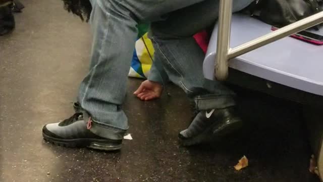 Grey pants woman passed out bent over seat subway