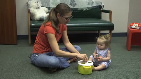 Mom playing with little daughter