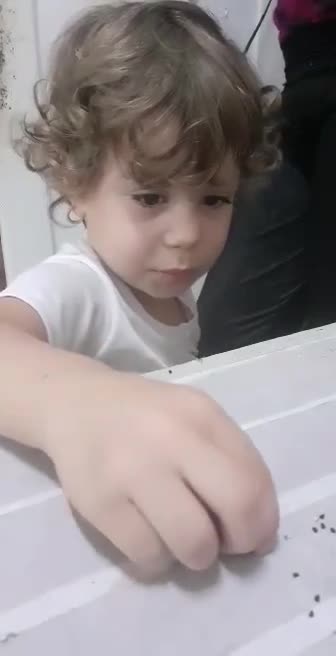 Baby girl wants to feed the birds