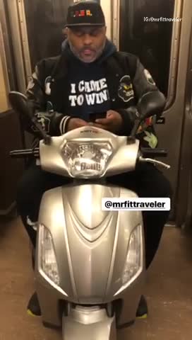 Man drives his moped into subway train and is on his phone