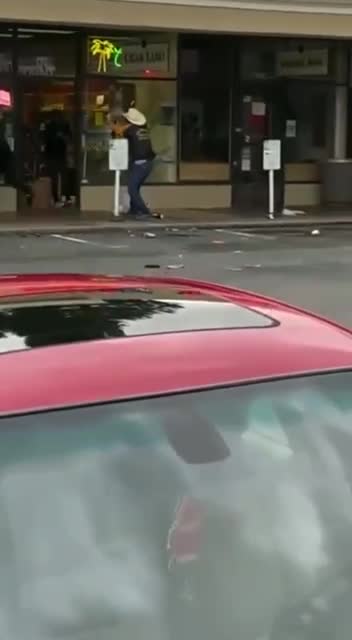 Man with gun chases out looters.