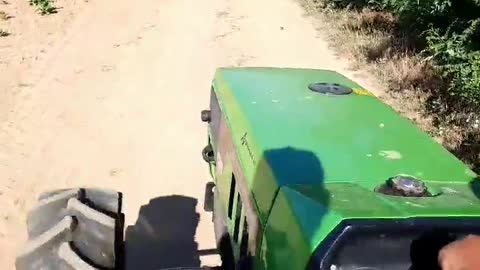 Driving tractor Deutz-Fahr with wheat