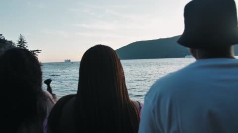 Group of Friends Looking at the Beauty of the Beach