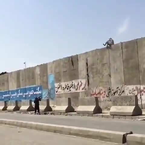 Taliban can be seen shooting at people trying to enter or leave Kabul airport.