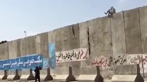 Taliban can be seen shooting at people trying to enter or leave Kabul airport.