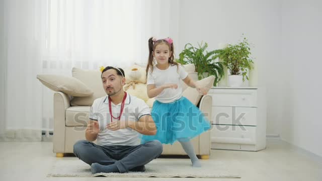 Kid dancing with Father