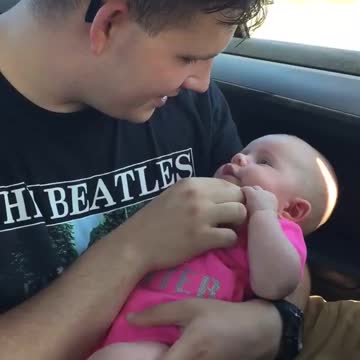 Daddy sings to his daughter
