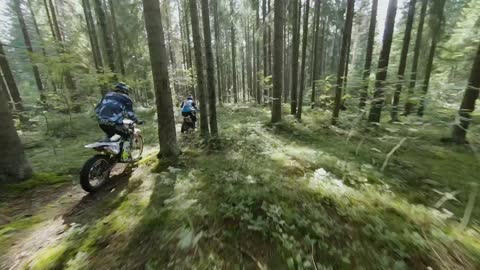 Aerial Footage of Two Motorcyclists in the Woods