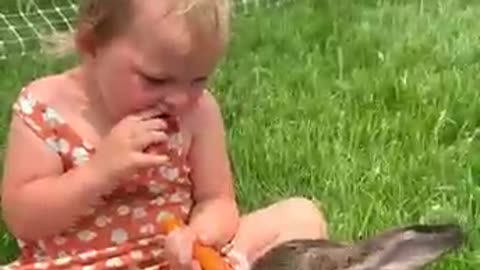 Sharing carrots with her bunny…BUT she has to keep her fingers away at the END 🥕