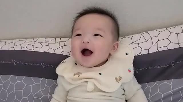 Four-month-old baby smiling