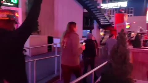 Protesters in Kansas City walk into a bar and stand on tables.