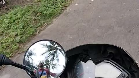 Drive motorcycle on village road