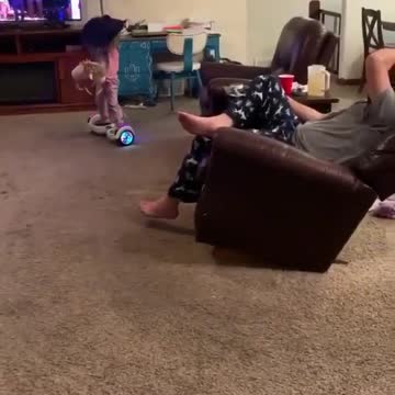 They play in the hall in front of their father