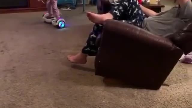 They play in the hall in front of their father