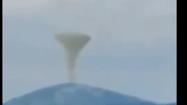 UFO over volcano eruption