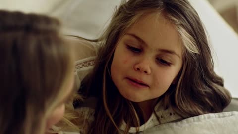 a-mother-playing-with-her-daughter-by-blowing-her-hair