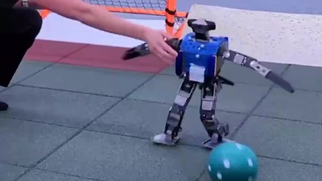 A Bipedal Robot Mastering Agile Football Skills Using Deep Reinforcement Learning Mimicking Human Learning Through Trial & Error