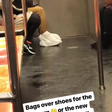 Guy in kahkis wears white bags on feet