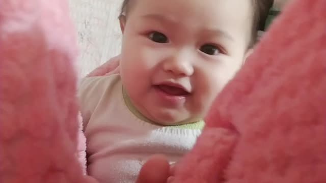 The baby's adorable expression when it's opened behind the curtain