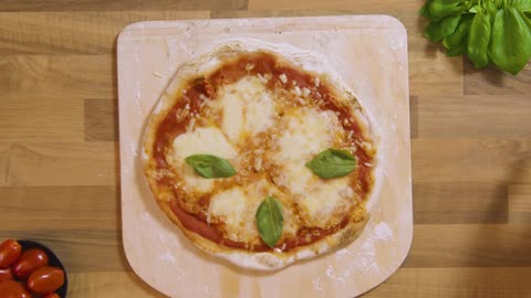 Top View Basil Placed on Cooked Cheese Pizza